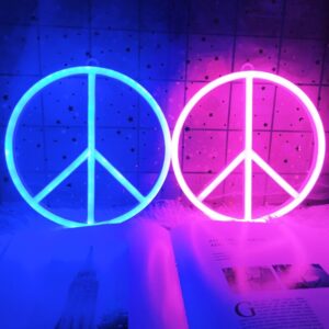 Enseigne néon rose et bleu du symbole de la paix